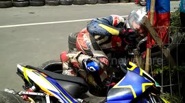 Moment of motor racers hit the onlooker