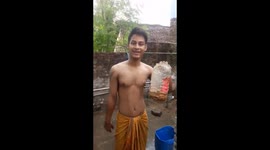 Man rubbing his body with ghost chilli