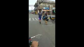 Fireman goes jogging with a goat