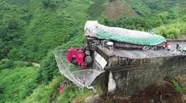 Video shows truck half-dangling off cliff after driver loses control