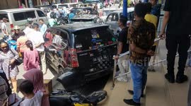 Car with disengaged handbrake rolls backwards causing multi-vehicle pile-up