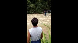 one of missing boy's body scoped out of the treacherous monsoon river
