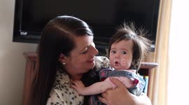 Baby born with full head of hair now boasts EIGHT INCH locks at the age of just six-months-old