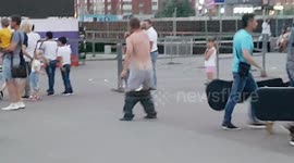 Russian man dances enthusiastically, strips to mark city day
