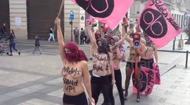Femen activists stage topless protest against ISIL in Paris