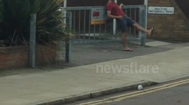 Man struggles to walk outside London pub