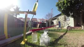 Pouring a cocktail using a Rube Goldberg machine