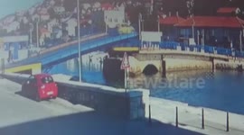 Car jumps across rising bridge in Croatia