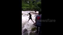 Moment villagers save cow from middle of flooded river in India