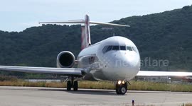 Departing Boeing jetblasts a women in the ocean (Skiathos Airport, 2018)