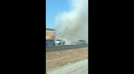 Grass fire burns next to interstate in North Central Texas