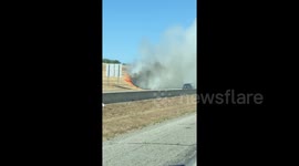 Grass fire burns next to interstate in North Central Texas