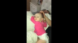 Cutest sight of baby getting her head massaged by Daddy