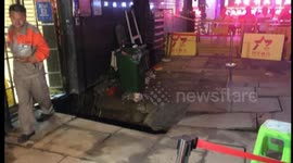 Sinkhole in China opens up moments after woman walks into shop