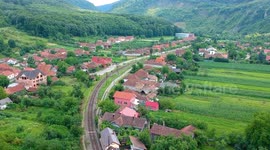 Trains in the Beautiful Romania - Drone shots of trains passing a bridge and through a canyon