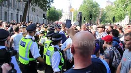 Tommy Robinson supporters clash with police in London