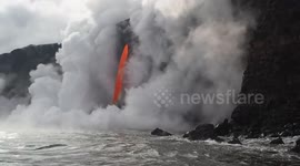 Spectacular footage shows lava spewing into sea off Hawaii during boat tour
