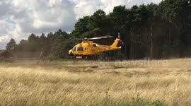 Lincs & Notts Ambucopter taking off, after attending the scene of a medical emergency.
