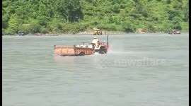 Tractor driver is swept away whilst crossing overflowing river
