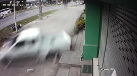 Out-of-control truck crashes into shops and parked cars