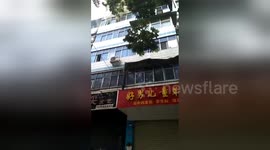 Desperate mum hurls children from burning 4th-floor apartment before succumbing to fumes