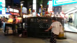 Crazy Woman dancing at Busy street in Taipei's Ximending Taiwan