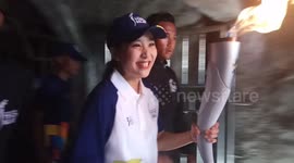 Asian Games torch passes through Japanese wartime tunnel in Indonesia