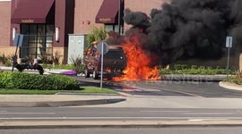 Man turns a corner and finds burning van next to jewellery store