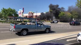 Car explodes and burns down in a raging flame in a parking lot!