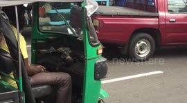 Driver sleeping in traffic - Sri Lanka