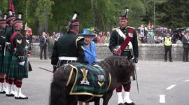 The Queen is welcomed by guard of honour Major Jonathan Thompson at the gates of Balmoral Castle and Estate in August 2018