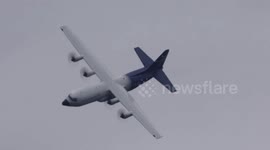 Lockheed Hercules LM-100 Cargo plane performs a loop at the Farnborough Air Show 2018