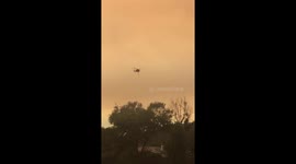 Helicopter fights Mendocino Complex fire, now largest in California history