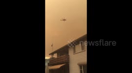 Helicopter fights Mendocino Complex fire, now largest in California history