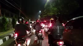 Traffic in Jakarta with 1 car driving through busway lane.