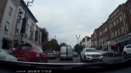 Van back door left swinging open, gas canister close to falling out onto road