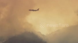 Plane drops retardant on Orange County Holy Fire
