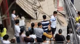 Shocking moment billboard collapses on passersby, injuring five