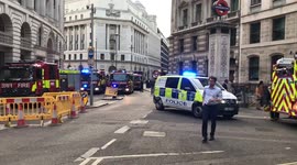Fire and police vehicles assemble at Bank station during fire alert