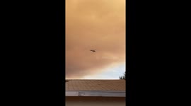 Helicopter races through orange sky and smoke in battle against Holy Fire