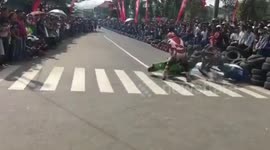 Unlucky rider crashes three times during moped race in Indonesia