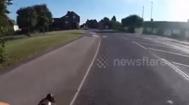 Cyclist nearly collides with a car after a reckless driver sharply pulls out - at a STOP junction