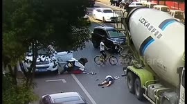 Helmet saves scooter driver's life after she is run over by a cement tanker