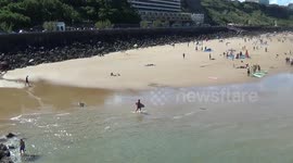 Tow-in surfing with lawn mower in Biarritz