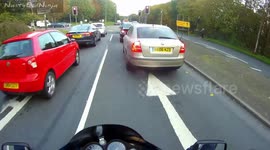 Car driver uses laptop to work whilst driving