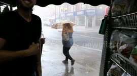 Torrential rain batters pedestrians in London