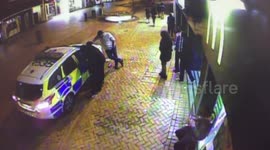 Thug Kicks Police Car