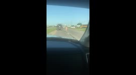 Naked man walking down highway 80