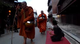 Morning Alms Offering to Monks in Chiang Khan Thailand