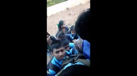 Indian students trying to get into a full Bus